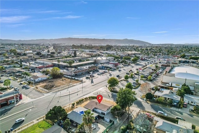 birds eye view of property featuring a mountain view