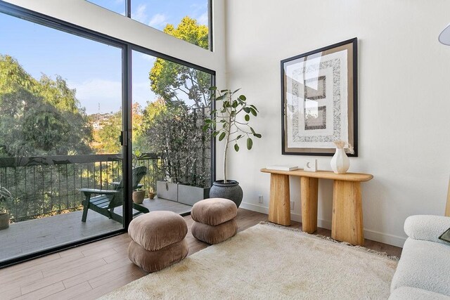 living area with hardwood / wood-style flooring