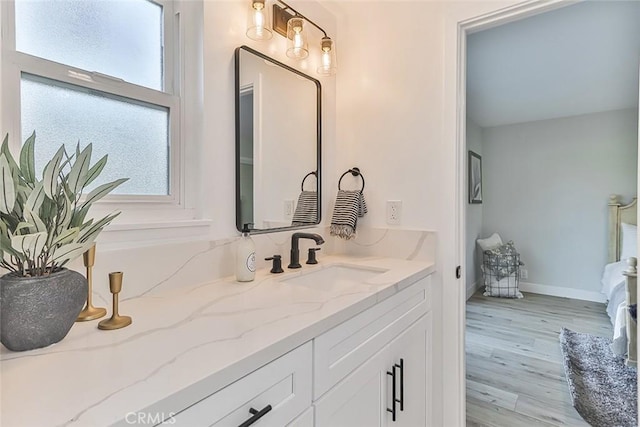 bathroom with hardwood / wood-style flooring and vanity