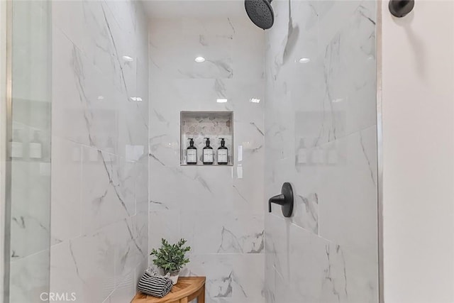 bathroom featuring tiled shower