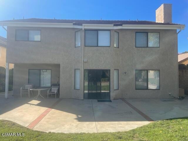 back of house featuring a patio