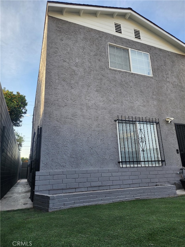 view of home's exterior featuring a lawn