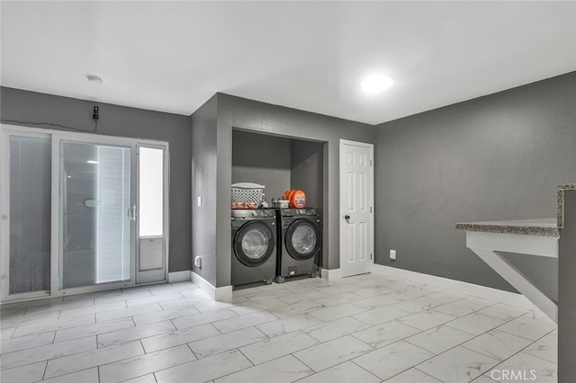 laundry area with washing machine and dryer