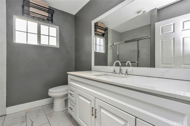 bathroom with toilet, walk in shower, and vanity