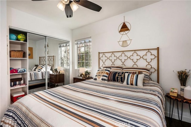 bedroom featuring ceiling fan, a closet, and hardwood / wood-style floors