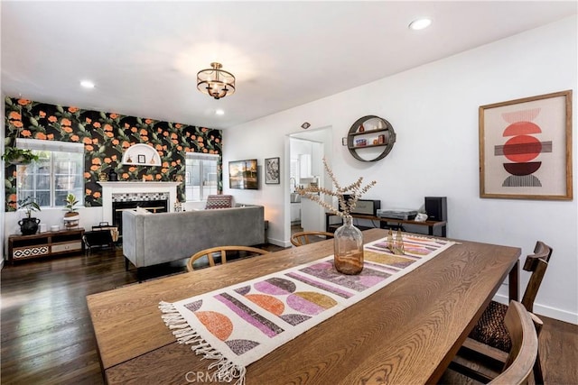 dining room featuring dark hardwood / wood-style floors and a healthy amount of sunlight