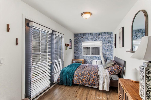 bedroom featuring wood-type flooring