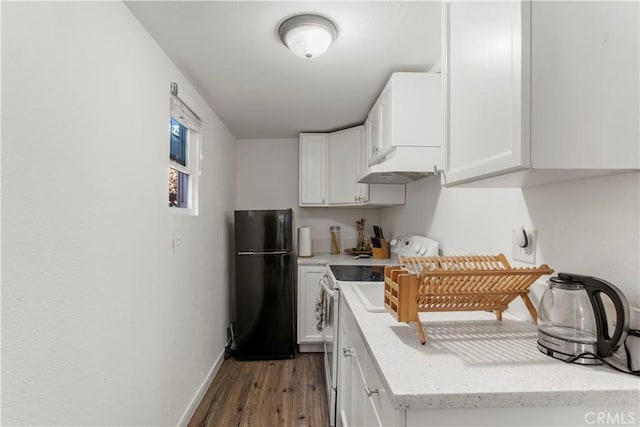 kitchen featuring white cabinetry, electric range oven, black refrigerator, dark wood-type flooring, and custom range hood