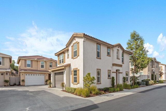 view of front of home featuring a garage and central air condition unit