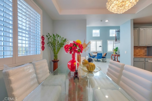 dining room featuring a chandelier and recessed lighting