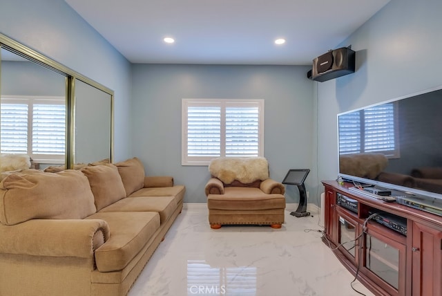 living room with baseboards and recessed lighting