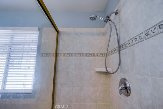 full bath featuring a tile shower