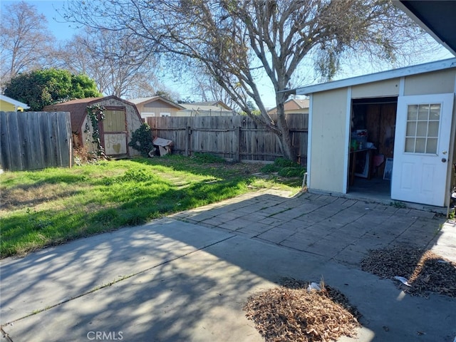 view of yard with a patio and a shed