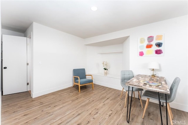 sitting room featuring light hardwood / wood-style floors