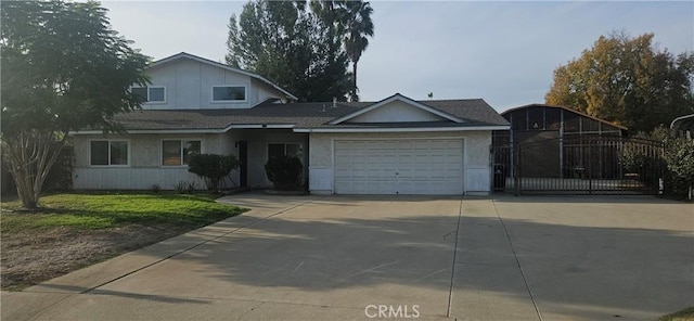 view of front of house with a front yard and a garage