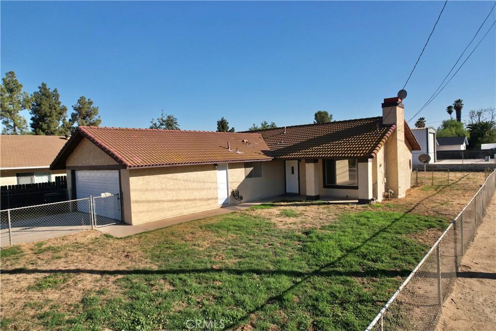 ranch-style house with a front lawn and a garage