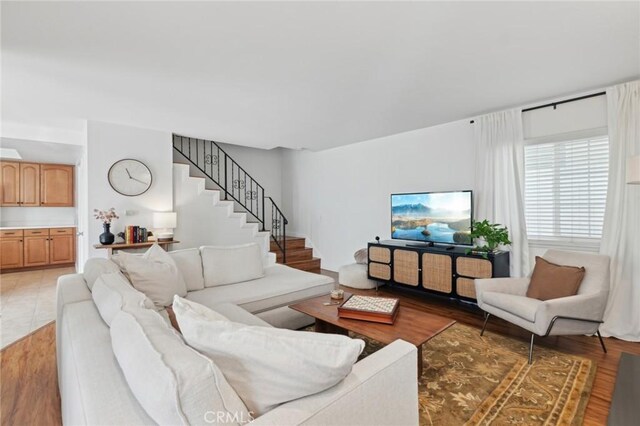 living room with dark hardwood / wood-style floors and a fireplace