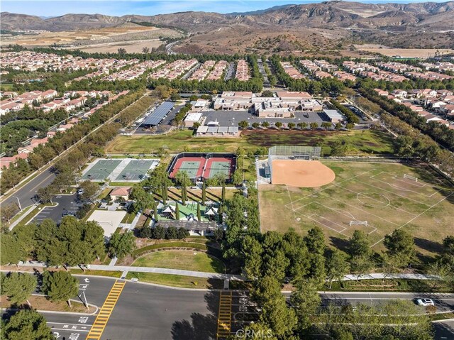 birds eye view of property with a mountain view