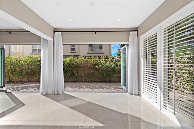 foyer entrance with light tile patterned floors