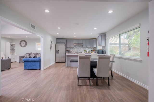 dining room with light hardwood / wood-style floors