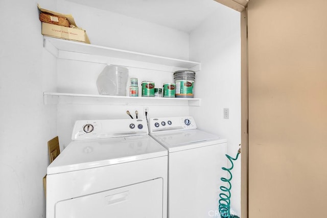 laundry area featuring washing machine and clothes dryer