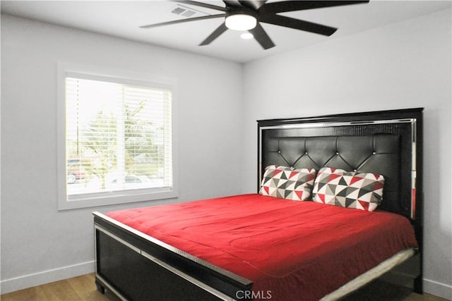 bedroom featuring ceiling fan and hardwood / wood-style floors