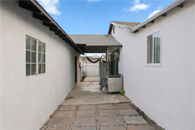 view of property exterior featuring a patio area