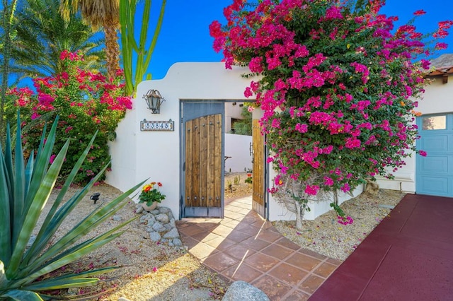 view of exterior entry featuring a garage