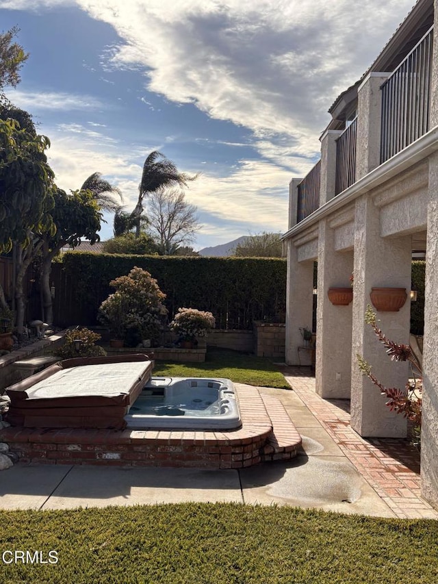 view of swimming pool with an outdoor hot tub and a patio