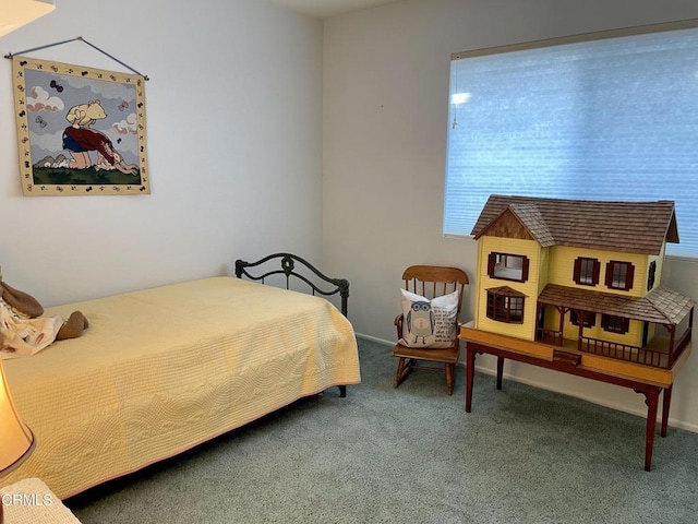 bedroom featuring baseboards and carpet floors