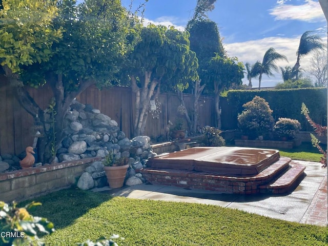 view of yard featuring fence and a fire pit