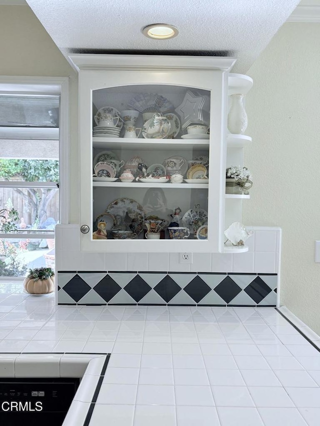 room details with built in features and a textured ceiling