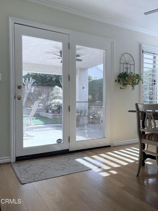1590 Frazier St, Camarillo, CA 93012 - doorway to outside with a ceiling fan, wood finished floors, and crown molding
