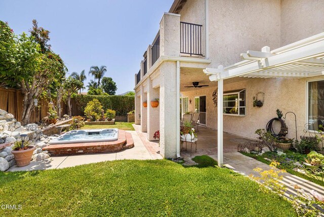 1590 Frazier St, Camarillo, CA 93012 - view of yard featuring a balcony, a ceiling fan, an outdoor hot tub, a patio area, and a pergola