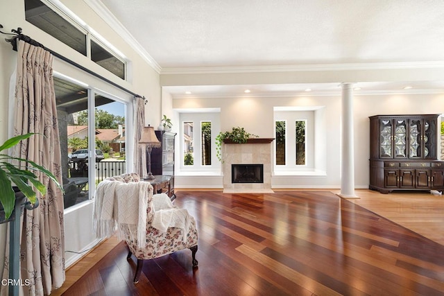 1590 Frazier St, Camarillo, CA 93012 - living room featuring ornate columns, a tile fireplace, wood-type flooring, and crown molding