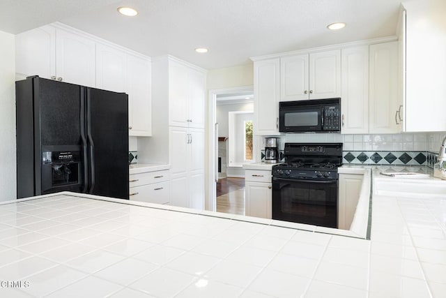 1590 Frazier St, Camarillo, CA 93012 - kitchen featuring black appliances, tile counters, white cabinetry, backsplash, and recessed lighting