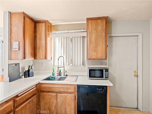 kitchen featuring sink and black dishwasher