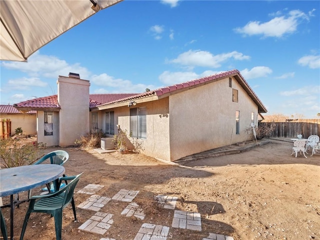 back of property with a patio