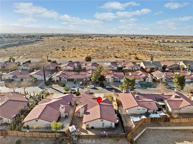 birds eye view of property featuring a mountain view