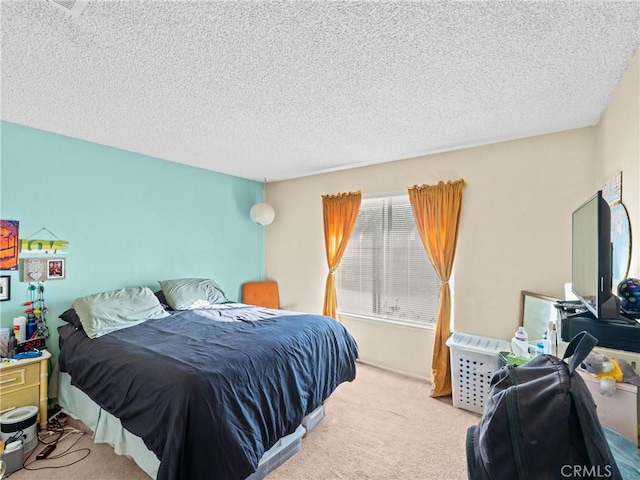 carpeted bedroom with a textured ceiling