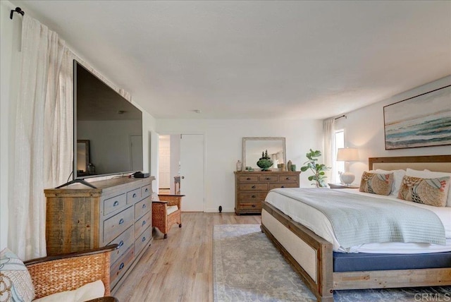 bedroom with light hardwood / wood-style flooring