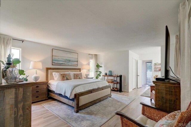 bedroom with light wood-type flooring