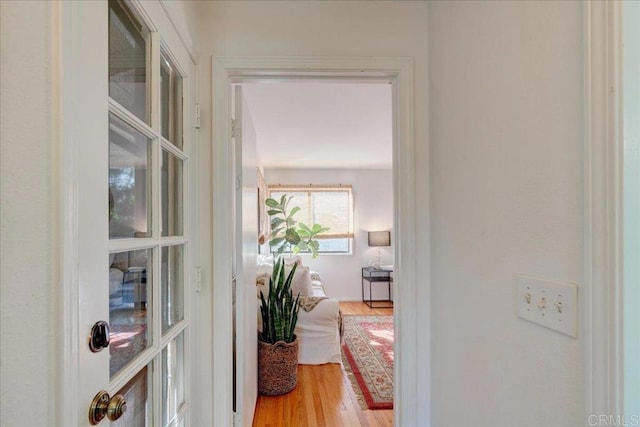 hall with light wood-type flooring