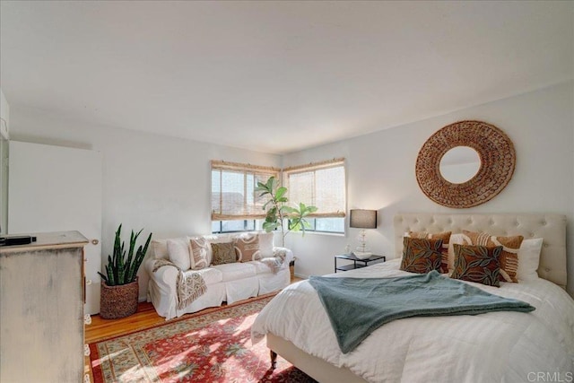 bedroom with hardwood / wood-style flooring