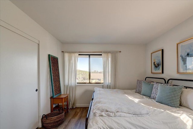 bedroom with hardwood / wood-style floors