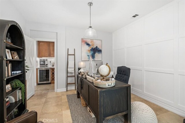 tiled office space featuring wine cooler