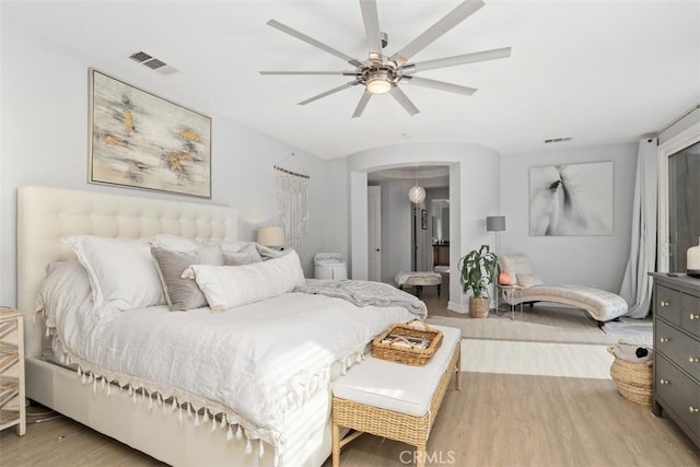 bedroom with ceiling fan and light hardwood / wood-style floors