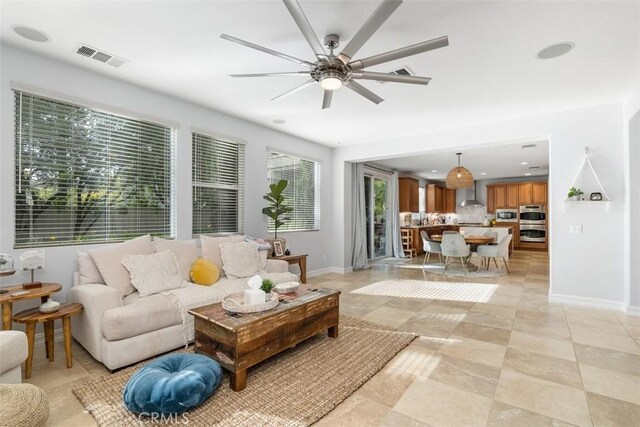 living room with ceiling fan