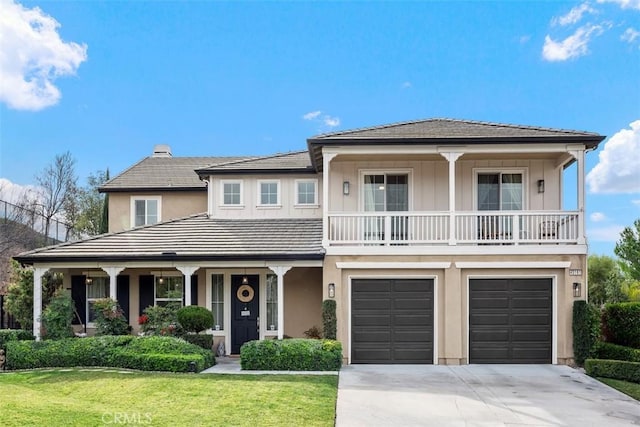 view of front of house with a garage and a front lawn