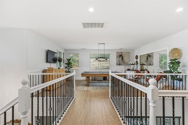 hallway with hardwood / wood-style flooring